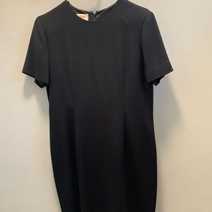Short sleeved black dress. Worn once. Very comfortable and flattering.